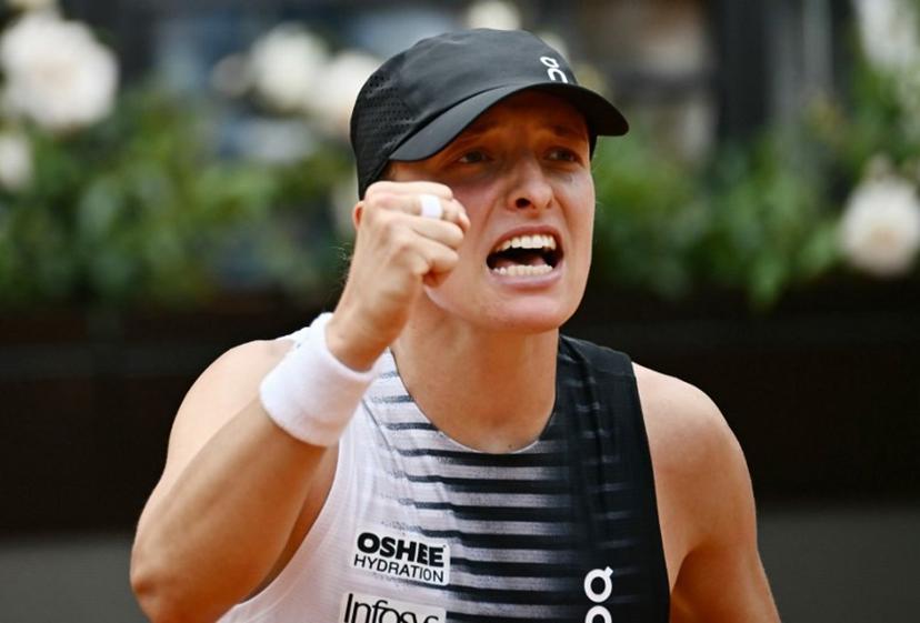Poland's Iga Swiatek celebrates after winning against USA's Jessica Pegula during the ATP Rome Open tennis tournament at Foro Italico in Rome on May 13, 2026. Filippo MONTEFORTE / AFP