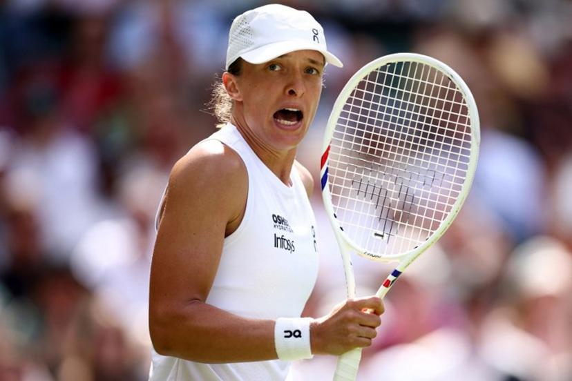 Poland's Iga Swiatek celebrates beating US player Taylor Townsend during their women's singles first round tennis match on the second day of the 2026 Wimbledon Championships at The All England Lawn Tennis and Croquet Club in Wimbledon, southwest London, on June 30, 2026. Henry Nicholls / AFP