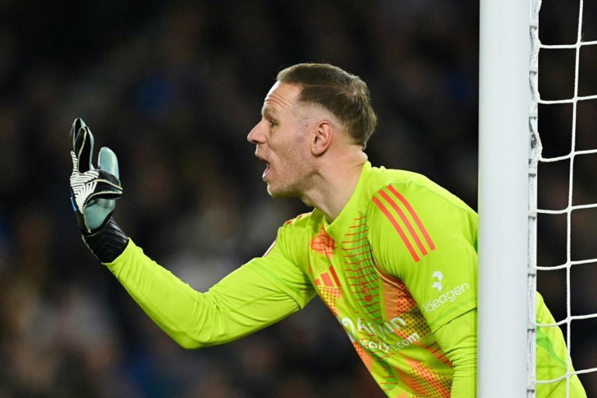Nottingham Forest's Belgian goalkeeper #26 Matz Sels gestures during the English FA Cup quarter-final football match between Brighton & Hove Albion and Nottingham Forest at the Amex stadium, in Brighton, on March 29, 2025. Glyn KIRK / AFP