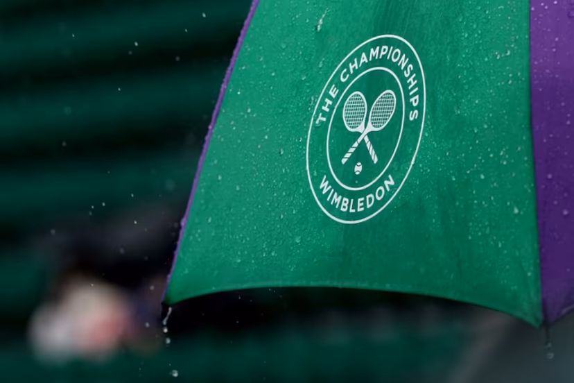 Rain falls from an umbrella on the seventh day of the 2025 Wimbledon Championships at The All England Lawn Tennis and Croquet Club in Wimbledon, southwest London, on July 6, 2025. Adrian Dennis / AFP