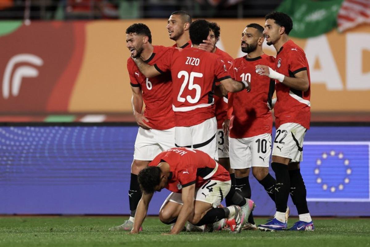 Egypt's defender #6 Yasser Ibrahim (L) celebrates scoring his team's second goal during the Africa Cup of Nations (CAN) round of 16 football match between Egypt and Benin at the Grand Stadium in Agadir on January 5, 2026. FRANCK FIFE / AFP