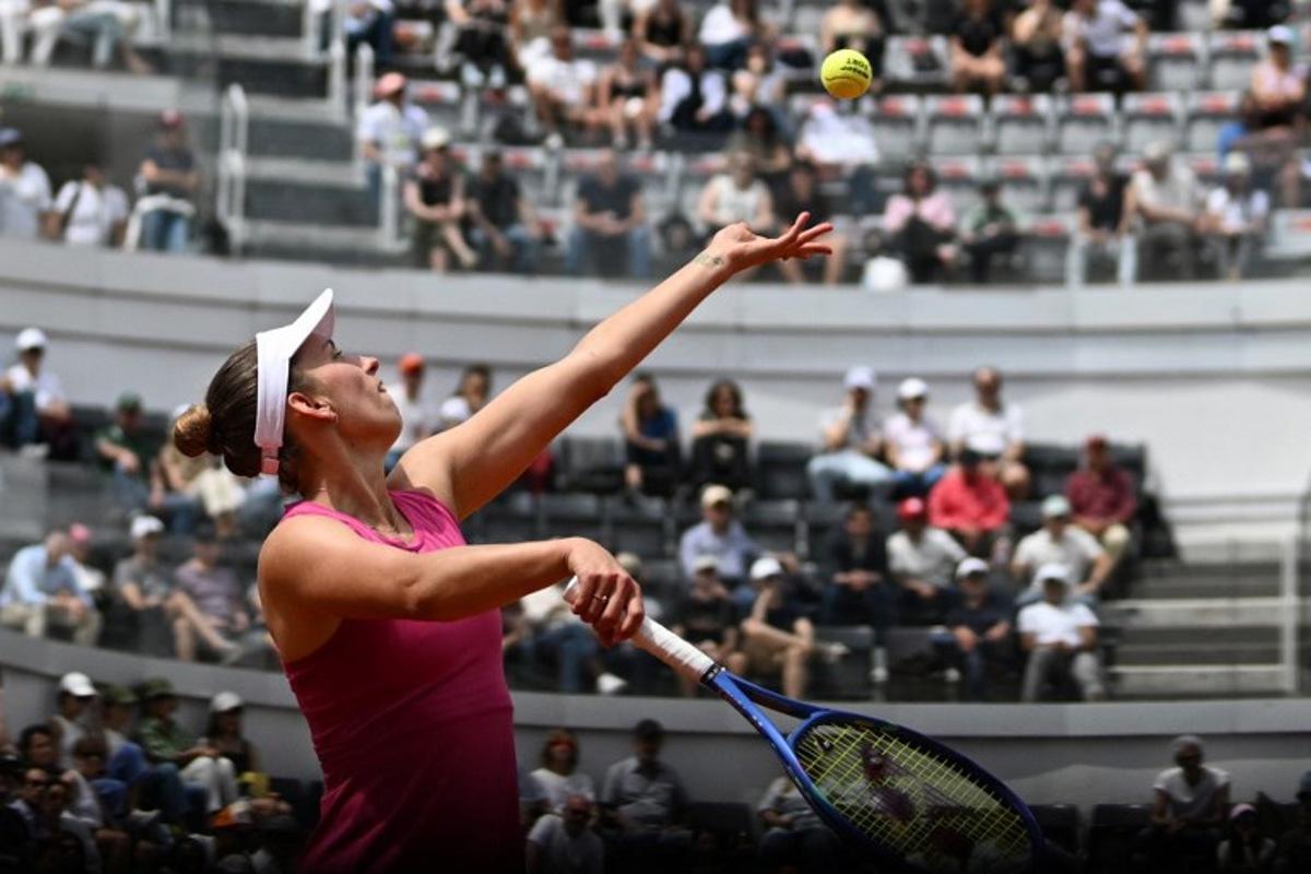Belgium's Elise Mertens serves to Italy's Jasmine Paolini during the WTA Rome Open tennis tournament at Foro Italico in Rome on May 9, 2026. Tiziana FABI / AFP