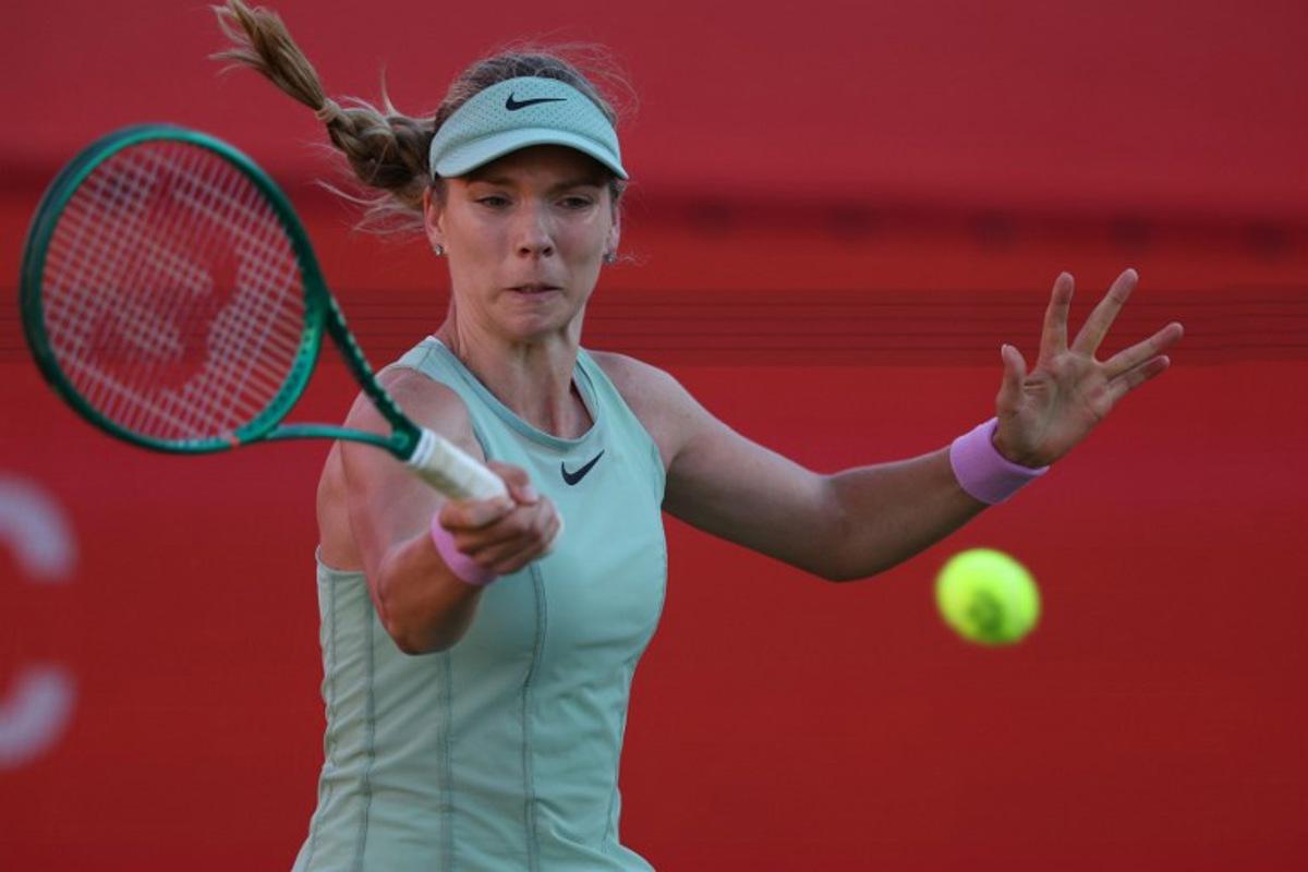 Britain's Katie Boulter returns against Kazakhstan's Elena Rybakina during their women's singles quarter-final tennis match at the HSBC WTA Championships at Queen's Club in west London on June 12, 2026. Adrian Dennis / AFP