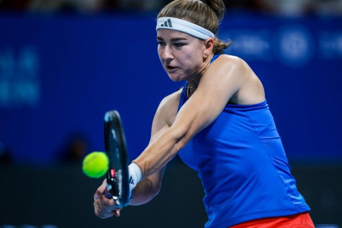 Czech Republic's Karolina Muchova hits a return to Spain's Jessica Bouzas Maneiro during their women's singles semi-final match at the Billie Jean King Cup tennis tournament in Shenzhen, in China's southern Guangdong province on September 25, 2026. CN-STR / AFP