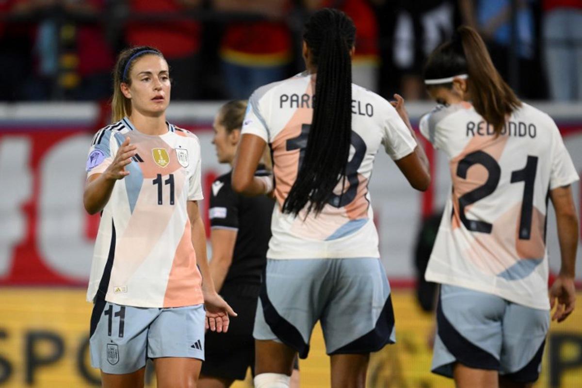 Spanish team players Spain's midfielder #11 Alexia Putellas, Spain's forward #18 Salma Paralluelo and Spain's forward #21 Alba Redondo celebrate their 5-1 win over belgium in the UEFA Women's Nations League group A3 football match between Belgium and Spain at the King Power at Den Dreef Stadium, in Leuven on May 30, 2025. JOHN THYS / AFP