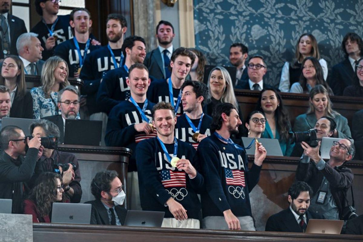 Members of the United States Olympic Men's Ice Hockey Teamare seen in the gallery as President Donald J. Trump delivers the first State of the Union address of his second term to a joint session of Congress in the House Chamber of the United States Capitol in Washington, DC, on February 24, 2026. Kenny HOLSTON / POOL / AFP