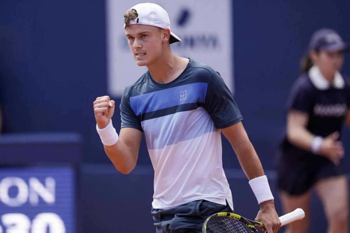 Denmark's Holger Rune reacts after winning a point against Spain's Carlos Alcaraz during the ATP Barcelona Open "Conde de Godo" tennis tournament singles final match at the Real Club de Tenis in Barcelona, on April 20, 2025. MANAURE QUINTERO / AFP