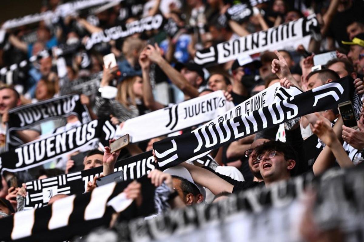 Juventus fans cheer during the Italian Serie A football match between Juventus and Bologna on April 16, 2022 at the Juventus stadium in Turin. MARCO BERTORELLO / AFP