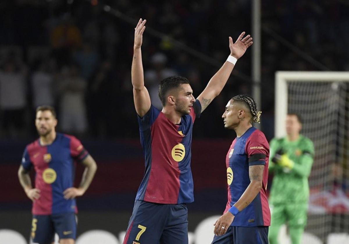 Barcelona's Spanish forward #07 Ferran Torres celebrates scoring his team's second goal with Barcelona's Brazilian forward #11 Raphinha (R) during the UEFA Champions League semi final first leg football match between FC Barcelona and Inter Milan at the Estadi Olimpic Lluis Companys in Barcelona on April 30, 2025. Josep LAGO / AFP