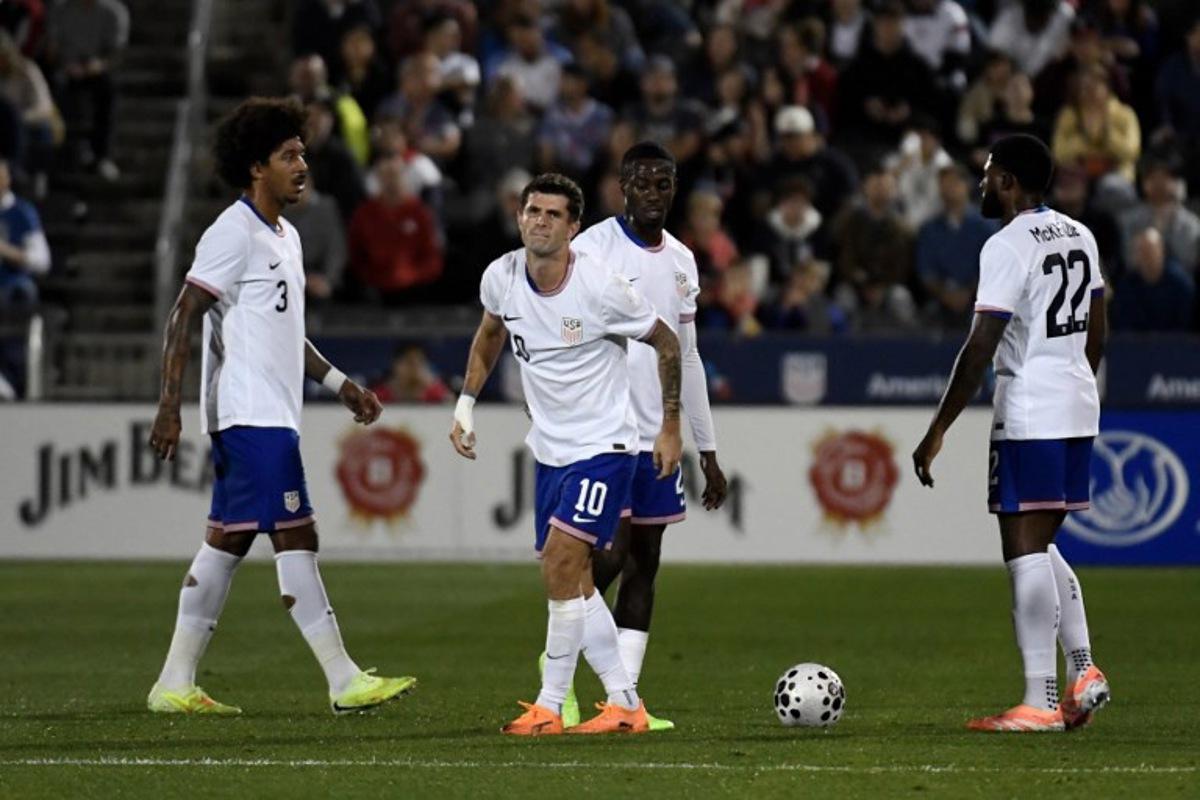 USA's midfielder #10 Christian Pulisic limps after being tripped during the international friendly football match between USA and Australia at Dick's Sporting Goods Park in Commerce City, Colorado, on October 14, 2025. Jason Connolly / AFP