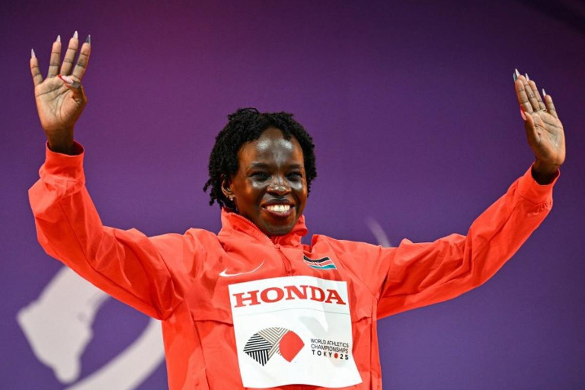 Gold medalist Kenya's Peres Jepchirchir celebrates on the podium for the women's marathon during the World Athletics Championships in Tokyo on September 14, 2025. Philip FONG / AFP