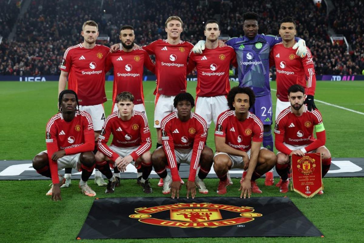 Manchester United's Cameroonian goalkeeper #24 Andre Onana, Manchester United's Moroccan defender #03 Noussair Mazraoui, Manchester United's Dutch defender #04 Matthijs de Ligt, Manchester United's English defender #26 Ayden Heaven, Manchester United's Portuguese defender #20 Diogo Dalot, Manchester United's Brazilian midfielder #18 Casemiro, Manchester United's Portuguese midfielder #08 Bruno Fernandes, Manchester United's Danish defender #13 Patrick Dorgu, Manchester United's Argentinian midfielder #17 Alejandro Garnacho, Manchester United's Danish striker #09 Rasmus Hojlund and Manchester United's Dutch striker #11 Joshua Zirkzee pose for a team photo ahead of the UEFA Europa League Last 16 Second Leg football match between Manchester United and Real Sociedad at Old Trafford stadium in Manchester, north west England, on March 13, 2025. Darren Staples / AFP