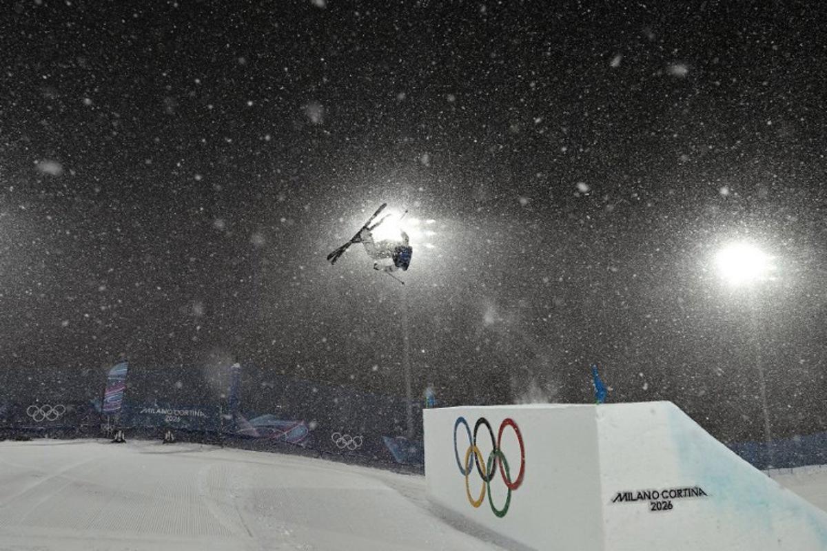China's Gu Ailing Eileen warms up in heavy snowfall prior to the freestyle skiing women's freeski big air final run 1 during the Milano Cortina 2026 Winter Olympic Games at Livigno Snow Park, in Livigno (Valtellina), on February 16, 2026. Jeff PACHOUD / AFP