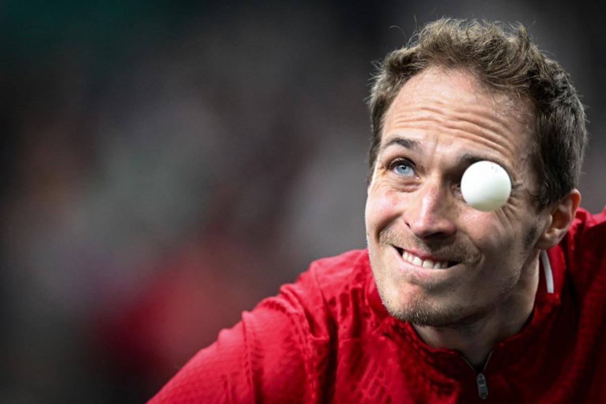 Belgium's Cedric Nuytinck eyes the ball as he plays a return against Sweden's Truls Moregard during their men's table tennis singles round of 64 at the Paris 2024 Olympic Games at the South Paris Arena in Paris on July 27, 2024. JUNG Yeon-je / AFP