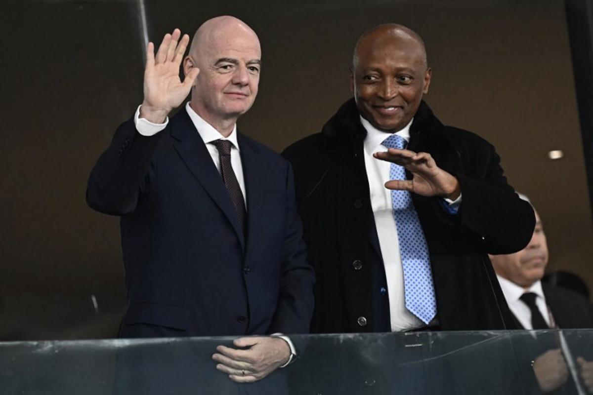 FIFA President Gianni Infantino (L) poses with CAF President Patrice Motsepe during the Africa Cup of Nations (CAN) round of 16 football match between South Africa and Cameroon at Al Medina Stadium in Rabat on January 4, 2026. Paul ELLIS / AFP