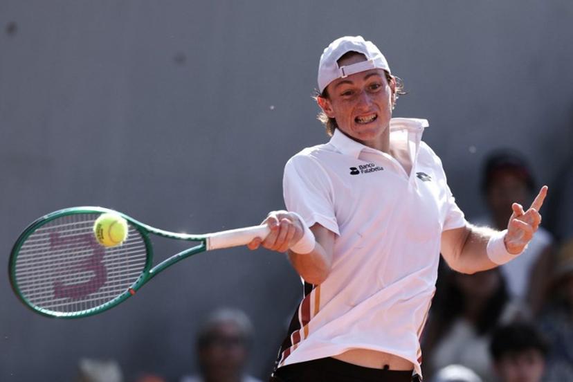 Peru's Ignacio Buse plays a forehand return to Russia's Andrey Rublev during their men's singles match on day 2 of the French Open tennis tournament at the Roland-Garros Complex in Paris on May 25, 2026. Alain JOCARD / AFP