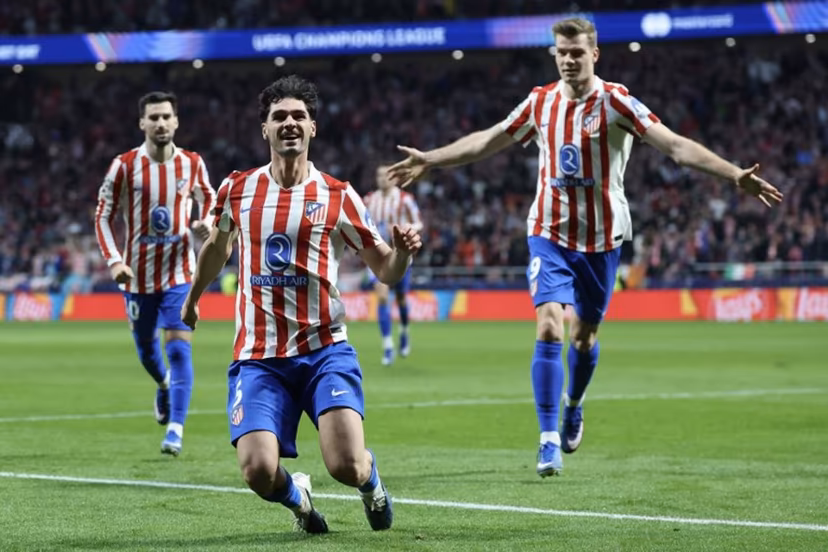 Atletico Madrid's US midfielder #05 Johnny Cardoso (C) celebrates scoring his team's second goal during the UEFA Champions League knockout round play-off second leg football match between Club Atletico de Madrid and Club Brugge KV at Metropolitano Stadium in Madrid on February 24, 2026. Pierre-Philippe MARCOU / AFP
