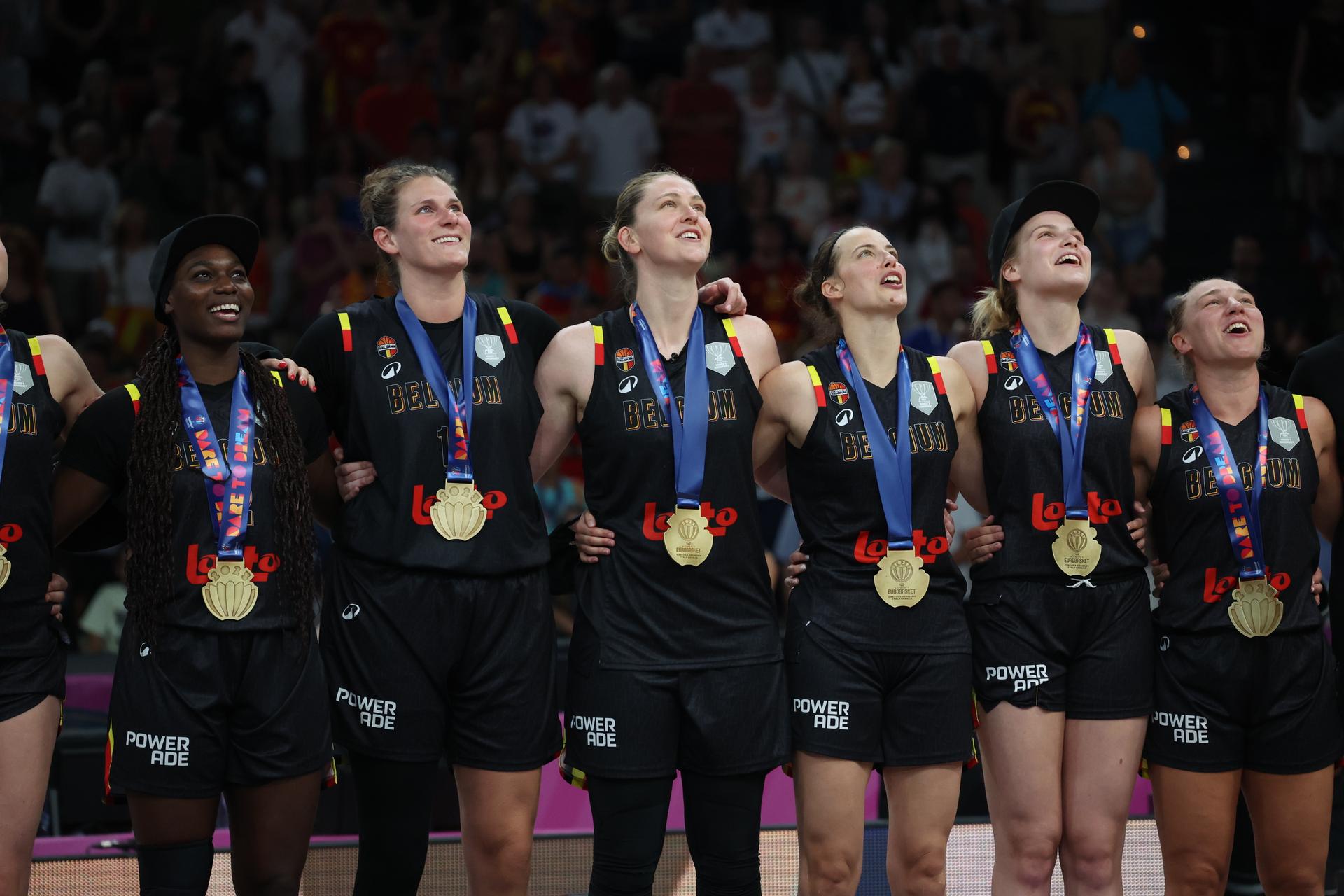 Belgium's Kyara Linskens, Belgium's Emma Meesseman, Belgium's Antonia Delaere and Belgium's Nastja Claessens celebrate after winning a basketball match between Spain and Belgian national team 'the Belgian Cats' on Sunday 29 June 2025 in Piraeus, Greece, the final of the FIBA Women's EuroBasket 2025. BELGA PHOTO VIRGINIE LEFOUR
