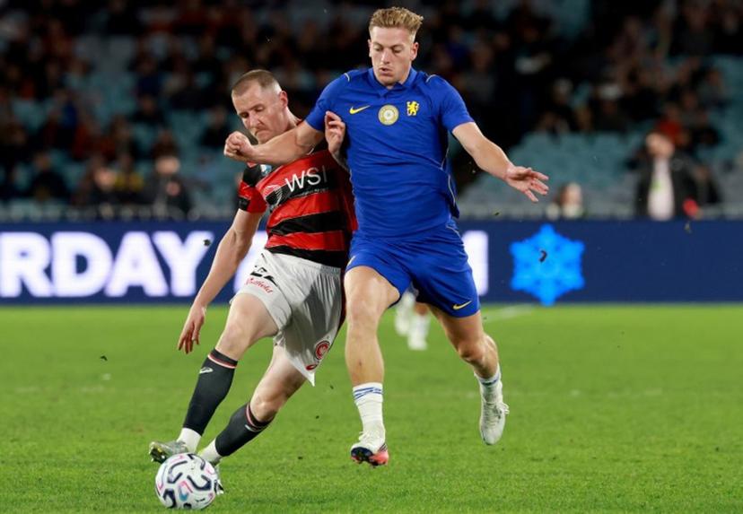 Chelsea's Liam Delap (R) is tackled by Wanderers's Anthony Pantazopoulos (L) during the Sydney Super Cup football match between Chelsea FC and the Western Sydney Wanderers at Stadium Australia in Sydney on July 28, 2026. DAVID GRAY / AFP