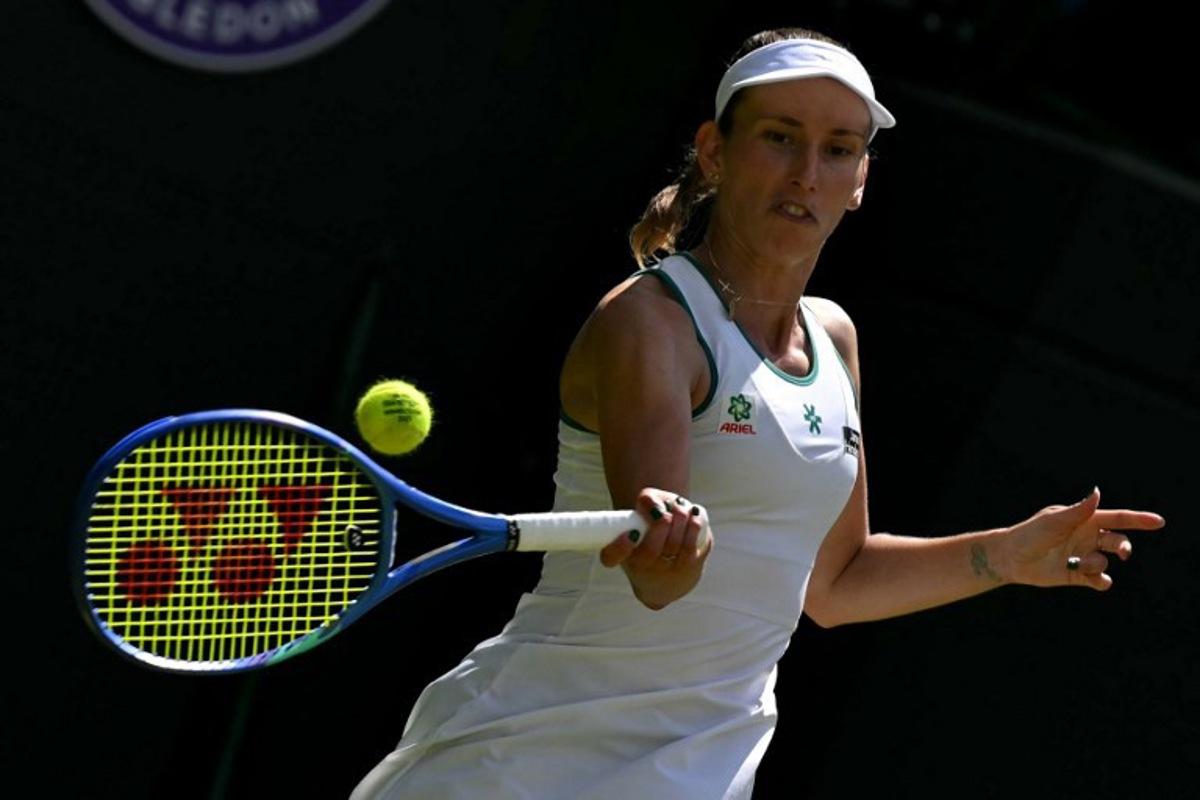 Belgium's Elise Mertens returns to Kazakhstan's Elena Rybakina during their women's singles third round tennis match on the sixth day of the 2026 Wimbledon Championships at The All England Lawn Tennis and Croquet Club in Wimbledon, southwest London, on July 4, 2026. Glyn KIRK / AFP
