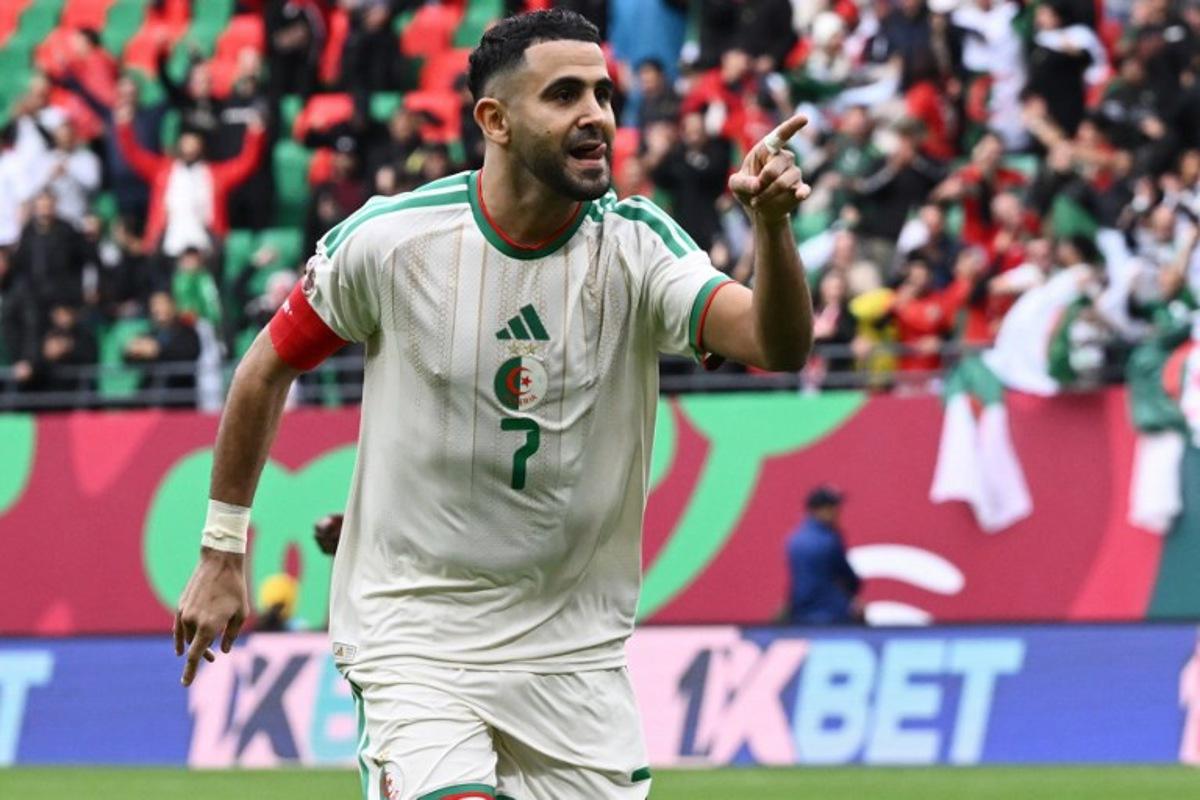 Algeria's forward #7 Riyad Mahrez celebrates scoring the team's first goal during the Africa Cup of Nations (CAN) Group E football match between Algeria and Sudan at Moulay Hassan Stadium in Rabat on December 24, 2025. SEBASTIEN BOZON / AFP