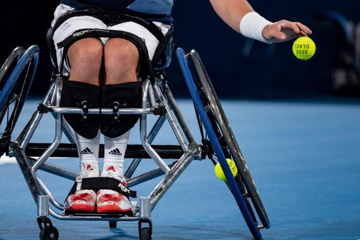 Britain's Alfie Hewett prepares to serve against France's Nicolas Peifer and Stephane Houdet during their men's doubles gold medal match at the Tokyo 2020 Paralympic Games at Ariake Tennis Park in Tokyo on September 3, 2021. Philip FONG / AFP