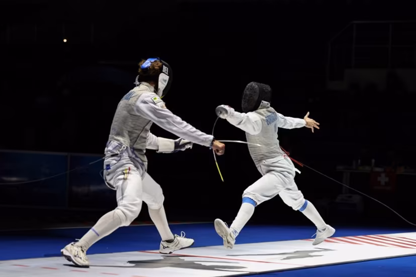 Individual Neutral Athlete Kirill Borodachev (R) and Belgium's Stef Van Campenhout compete in their men's foil individual bout during the FIE Fencing World Championships in Tbilisi on July 23, 2025. Giorgi ARJEVANIDZE / AFP