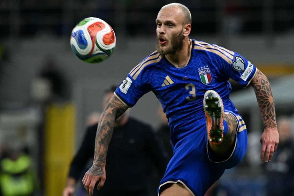 Italy's defender #03 Federico Dimarco controls the ball during the FIFA World Cup 2026 European qualification football match between Italy and Norway, at the San Siro Stadium, in Milan, on November 16, 2025. Stefano RELLANDINI / AFP