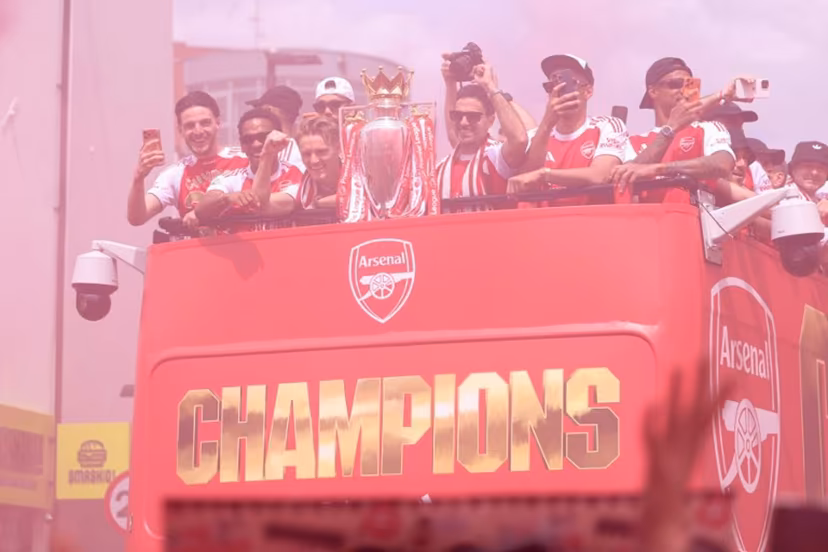 (L-R) Arsenal's English midfielder #41 Declan Rice, Arsenal's Dutch defender #12 Jurrien Timber, Arsenal's Norwegian midfielder #08 Martin Odegaard, Arsenal's Spanish manager Mikel Arteta, Arsenal's French defender #02 William Saliba and Arsenal's Brazilian defender #06 Gabriel Magalhaes celebrate with the Premier League trophy during a victory parade around the streets near to the Emirates Stadium, in London, on May 31, 2026. It is the first Premier League title for the North London team since the 2003-04 season. Toby Shepheard / AFP