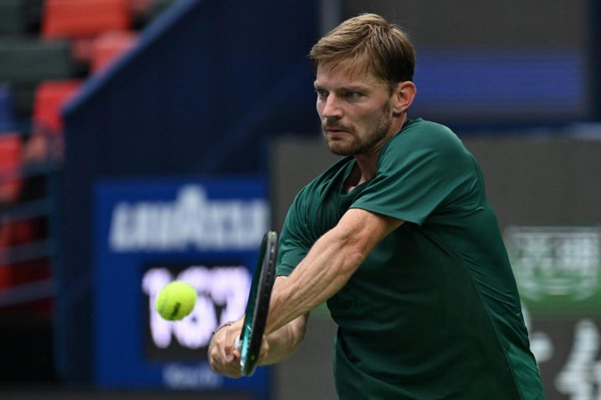 Belgium's David Goffin hits a return to USA's Ben Shelton during their men's singles match at the Shanghai Masters tennis tournament in Shanghai on October 3, 2025. Jade Gao / AFP
