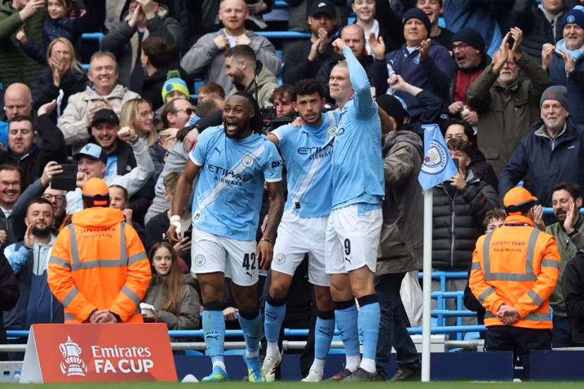 Manchester City's Norwegian striker #09 Erling Haaland (R) celebrates with teammates after scoring their second goal during the English FA Cup quarter final football match between Manchester City and Liverpool at the Etihad Stadium in Manchester, north west England, on April 4, 2026. Darren Staples / AFP