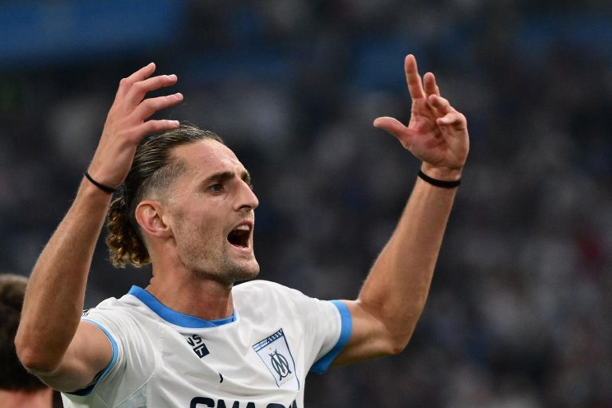 Marseille's French midfielder #25 Adrien Rabiot celebrates after scoring during their ligue 1 football match Olympic of Marseille (OM) against stade Rennais at the Velodrome stadium in Marseille on May 17, 2025. Christophe SIMON / AFP