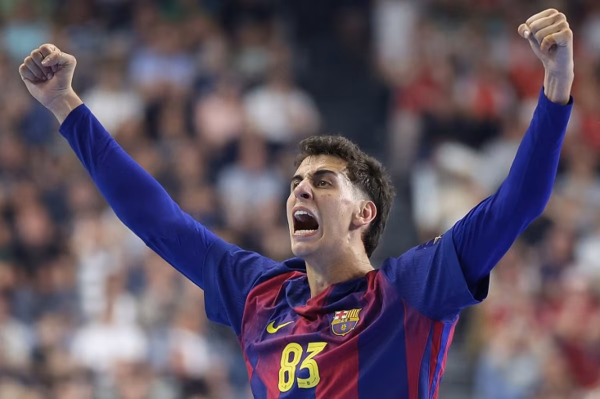 FC Barcelona's Spanish left wing #83 Ian Barrufet celebrates during the EHF Men's Handball Champions League Final 4 final between Barca and Fuechse Berlin in Cologne, western Germany on June 14, 2026. Ronny HARTMANN / AFP