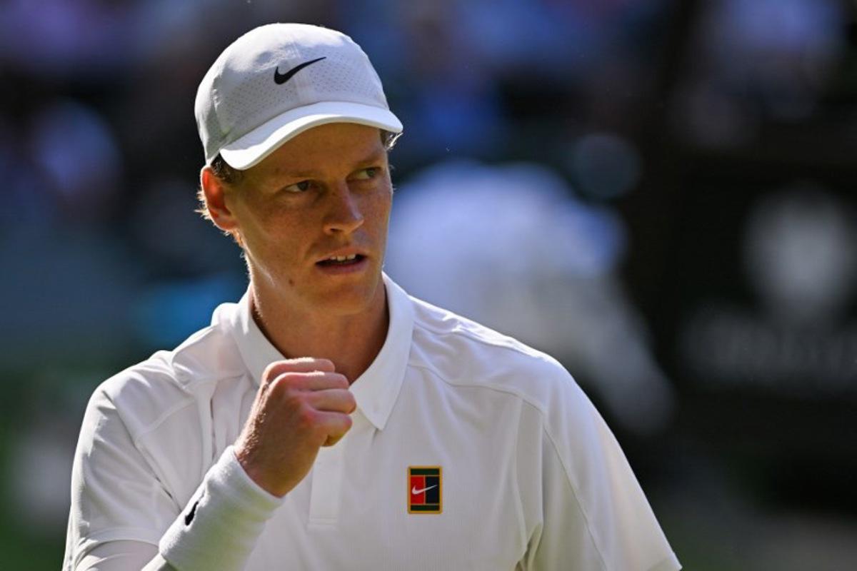 Italy's Jannik Sinner celebrates winning the second set against Serbia's Novak Djokovic during their men's singles semi-final tennis match on the twelfth day of the 2025 Wimbledon Championships at The All England Lawn Tennis and Croquet Club in Wimbledon, southwest London, on July 11, 2025. Glyn KIRK / AFP
