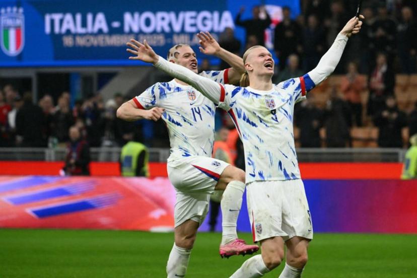 Norway's captain #09 Erling Braut Haaland and Norway's defender #14 Julian Ryerson celebrates their victory at the end of the FIFA World Cup 2026 European qualification football match between Italy and Norway, at the San Siro Stadium, in Milan, on November 16, 2025. Alberto PIZZOLI / AFP