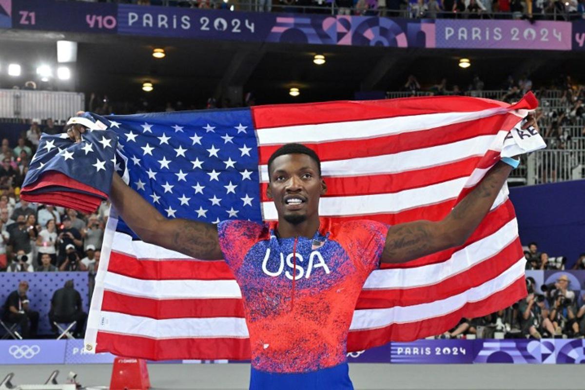 US' Fred Kerley celebrates after winning bronze in the men's 100m final of the athletics event at the Paris 2024 Olympic Games at Stade de France in Saint-Denis, north of Paris, on August 4, 2024. Andrej ISAKOVIC / AFP