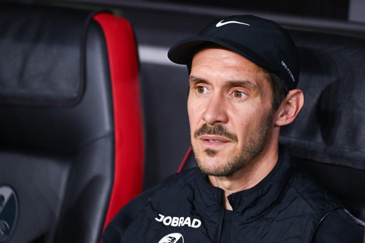 Freiburg's German head coach Julian Schuster sits on the bench prior to the UEFA Europa League semi-final second leg football match between SC Freiburg and SC Braga in Freiburg im Breisgau, southwestern Germany on May 7, 2026. Silas STEIN / AFP