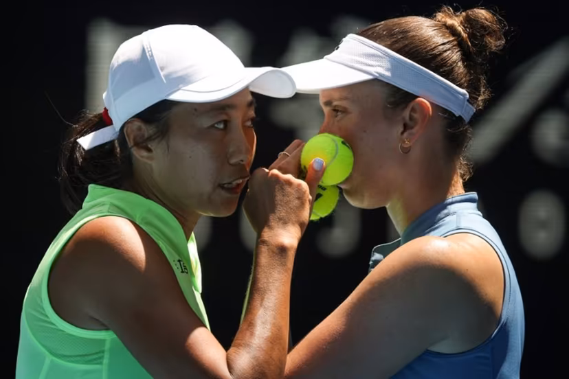 China's Zhang Shuai (L) talks to partner Belgium's Elise Mertens during their women's doubles final match against Kazakhstan's Anna Danilina and Serbia's Aleksandra Krunic on day fourteen of the Australian Open tennis tournament in Melbourne on January 31, 2026. DAVID GRAY / AFP