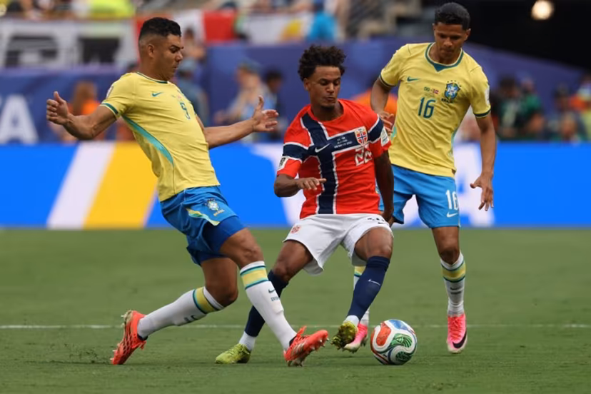 Brazil's midfielder #05 Casemiro and Norway's midfielder #22 Oscar Bobb fight for the ball past Brazil's defender #16 Douglas Santos during the 2026 World Cup round of 16 football match between Brazil and Norway at the New York/New Jersey Stadium in East Rutherford on July 5, 2026. Odd ANDERSEN / AFP