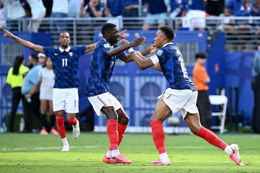 France's forward #10 Kylian Mbappe (R) celebrates scoring his team's first goal with forward #07 Ousmane Dembele during the 2026 World Cup round of 32 football match between France and Sweden at the New York/New Jersey Stadium in East Rutherford on June 30, 2026. Jewel SAMAD / AFP