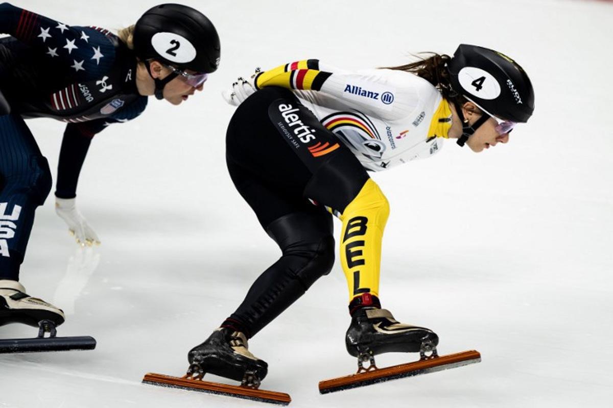 Belgium's Hanne Desmet (R) and US' Kristen Santos-Griswold compete in the Women 1500m Finals during the 2024/2025 ISU Short Track Speed Skating World Cup Milan 2025, part of a Milano Cortina 2026 Winter Olympic Games test event, at the Milano Speed Skating Stadium on February 16, 2025. MARCO BERTORELLO / AFP