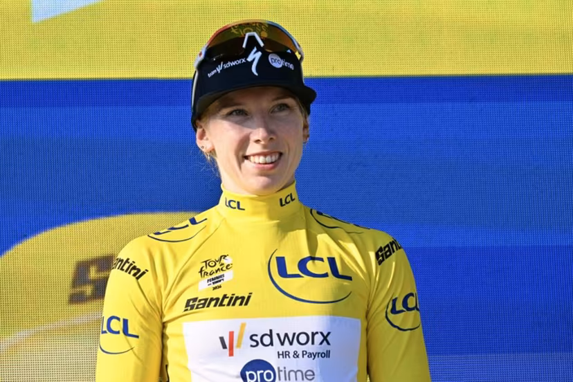 Yellow jersey of overall leader Team SD Worx-Protime's Dutch rider Lorena Wiebes poses on the podium after she won the first (out of 9) stage of the fifth edition of the Women's Tour de France cycling race, 138 km from Lausanne to Lausanne on August 1, 2026. NICOLAS TUCAT / AFP