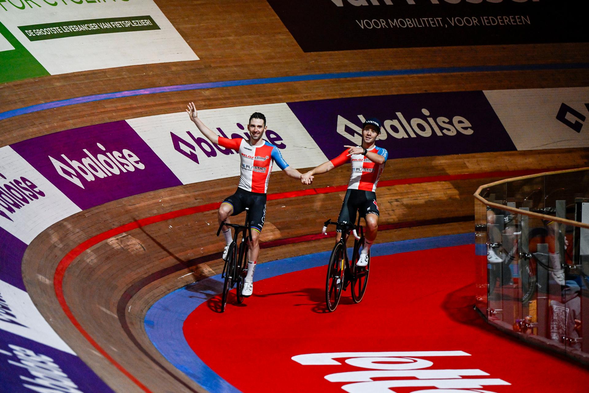 French Benjamin Thomas and Belgian Fabio Van Den Bossche celebrate after winning the sixth and last day of the Zesdaagse Vlaanderen-Gent six-day indoor track cycling event at the indoor cycling arena 't Kuipke, Sunday 17 November 2024, in Gent. BELGA PHOTO TOM GOYVAERTS