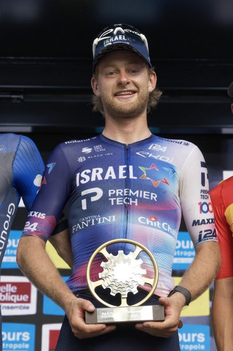 First-placed Israel Premier Tech's US rider Riley Sheehan celebrates on the podium after winning the 117th edition of the 213,9 km Paris-Tours one day cycling race, in Tours, central France on October 8, 2023. GUILLAUME SOUVANT / AFP