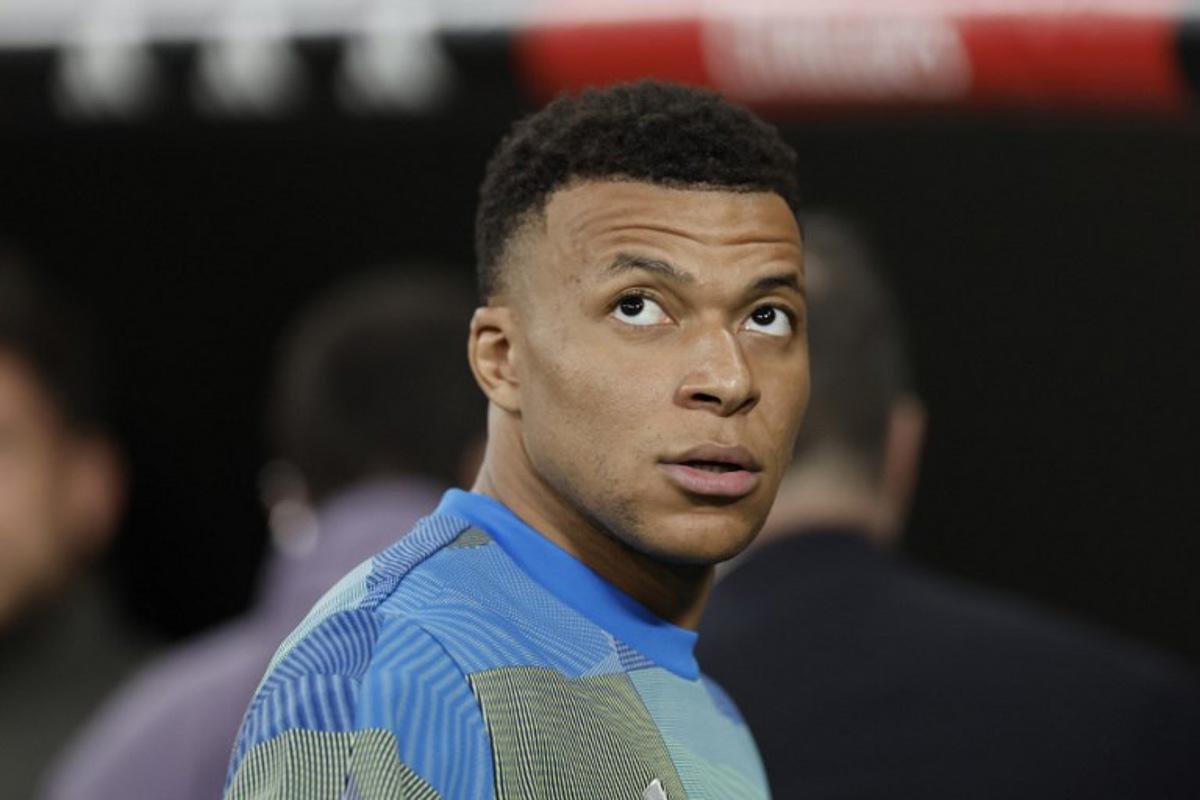 Real Madrid's French forward #10 Kylian Mbappe looks upwards before the Spanish league football match between Real Madrid CF and Club Atletico de Madrid at Santiago Bernabeu Stadium in Madrid on March 22, 2026. Oscar DEL POZO / AFP