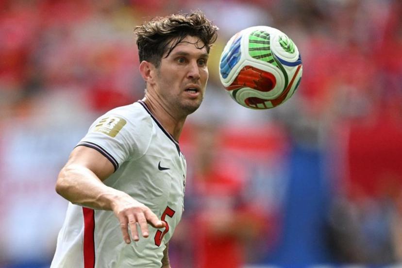 England's defender #05 John Stones looks at the ball during the 2026 World Cup football tournament quarter-final match between Norway and England at Miami Stadium in Miami Gardens on July 11, 2026. MAURO PIMENTEL / AFP
