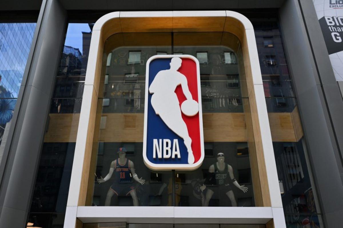 The NBA logo is seen outside an NBA fan store in New York on July 8, 2024. ANGELA WEISS / AFP