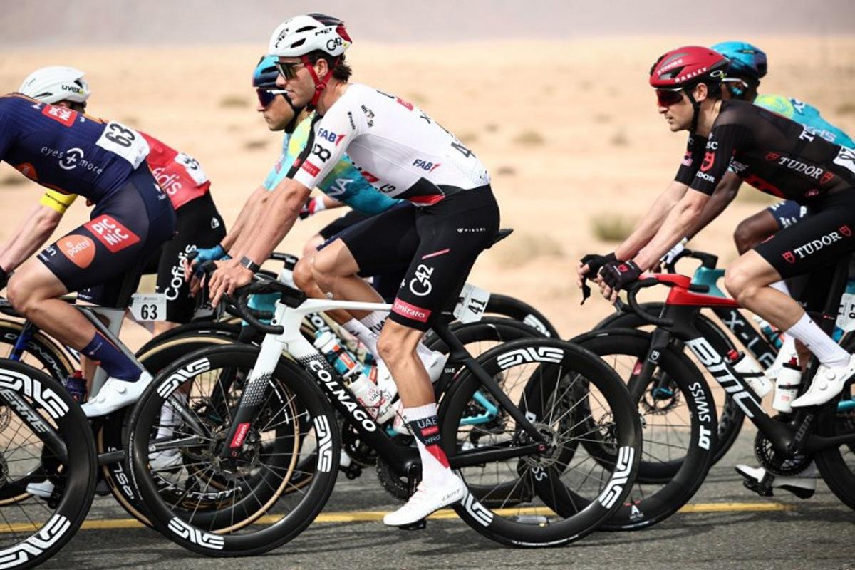 UAE Team Emirates cycling team's Swiss Jan Christen rides during the first stage of the AlUla Tour cycling race, a 158 km race started and finished in the Saudi desert city of AlUla, on January 27, 2026. Anne-Christine POUJOULAT / AFP