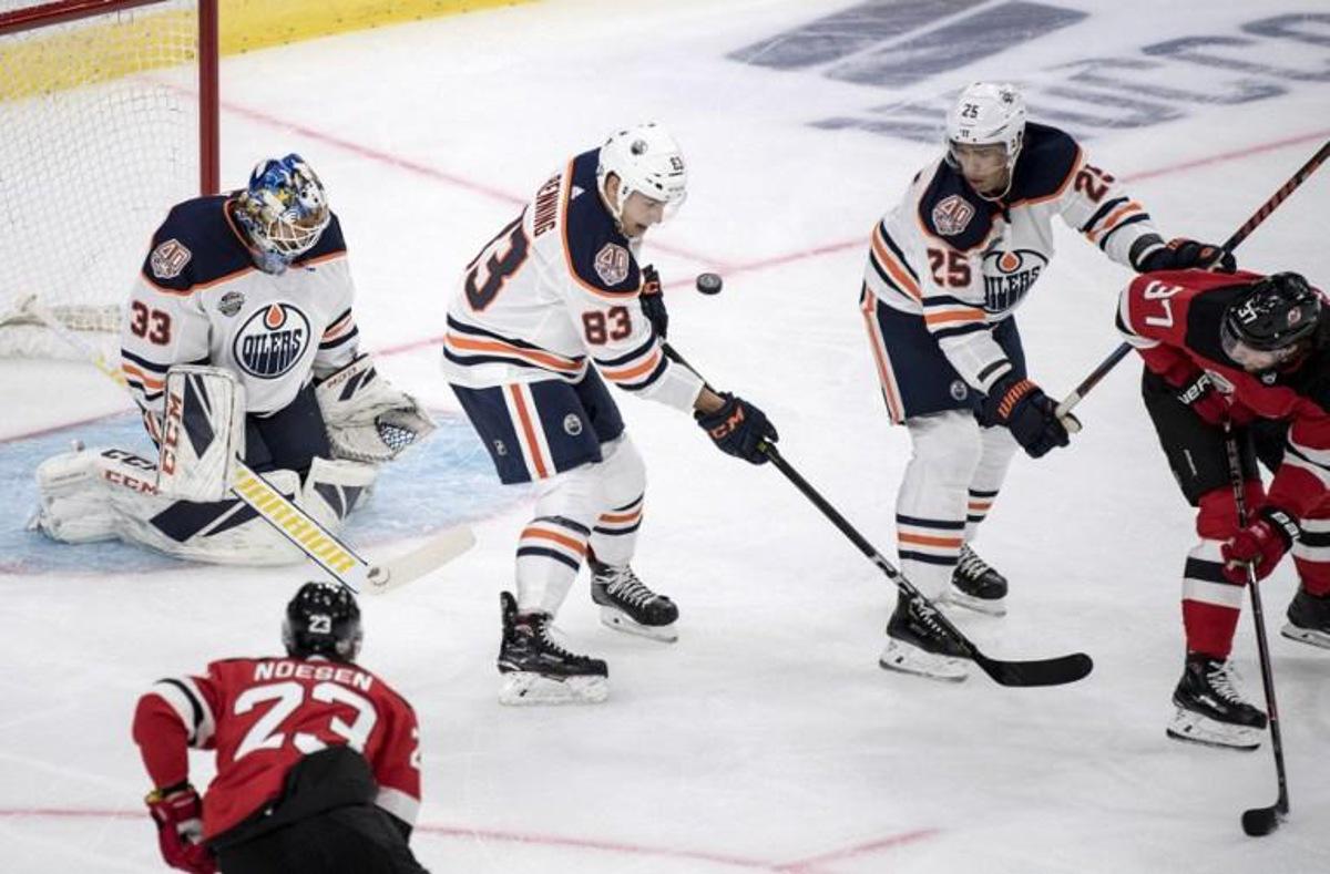 Edmonton Oilers' Matt Benning blocks a shot in front of Edmontons goalie Cam Talbo during the season-opening NHL Global Series ice hockey match between Edmonton Oilers and New Jersey Devils at Scandinavium in Gothenburg, Sweden, on October 6, 2018. Bjorn LARSSON ROSVALL / TT News Agency / AFP Sweden OUT RESTRICTED TO EDITORIAL USE