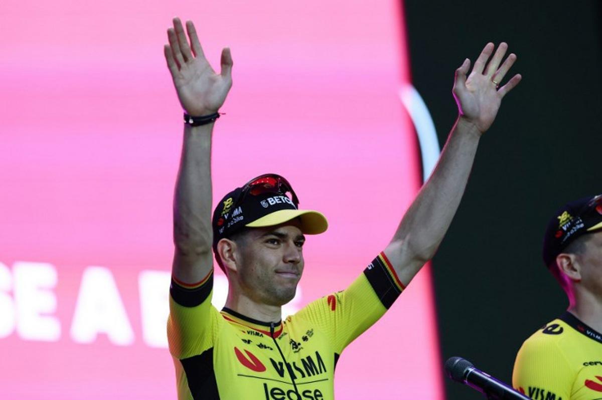 Team Visma-Lease a Bike's Belgian rider Wout Van Aert waves on stage during the opening ceremony and team presentation in Tirana, on May 7, 2025, two days before the departure of the Giro d'Italia 2025 cycling race. The Giro d'Italia 2025 cycling race will depart from Durres, Albania on May 9, and finish in Rome on June 1. Luca Bettini / AFP